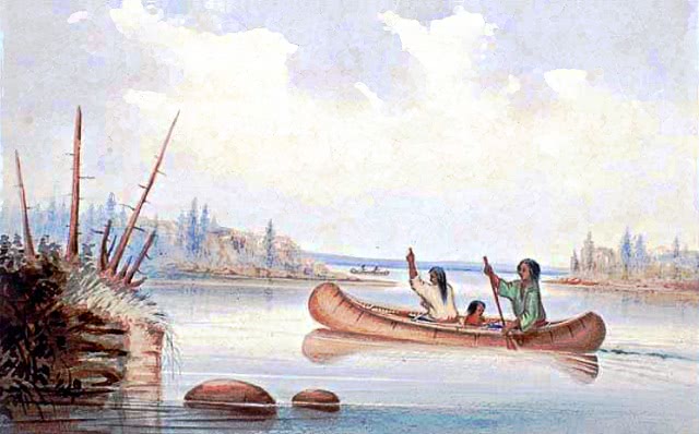 Indian family in canoe
