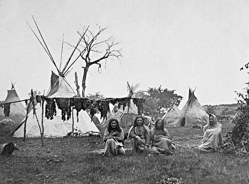 Arapaho camp with buffalo meat drying