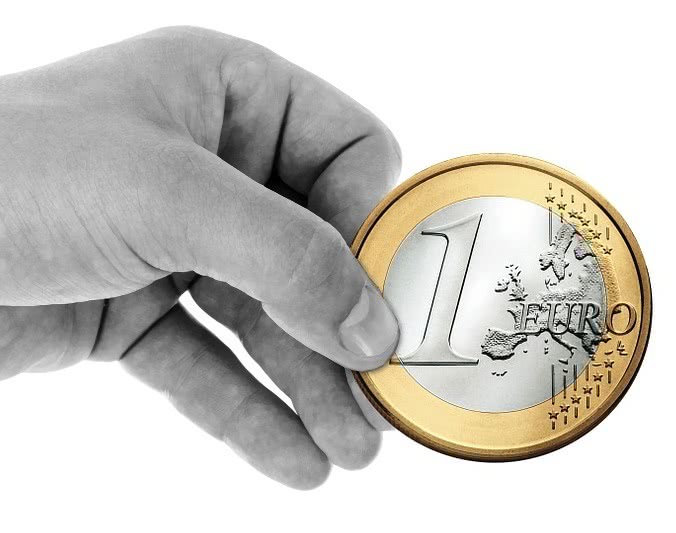 euro coin in hand