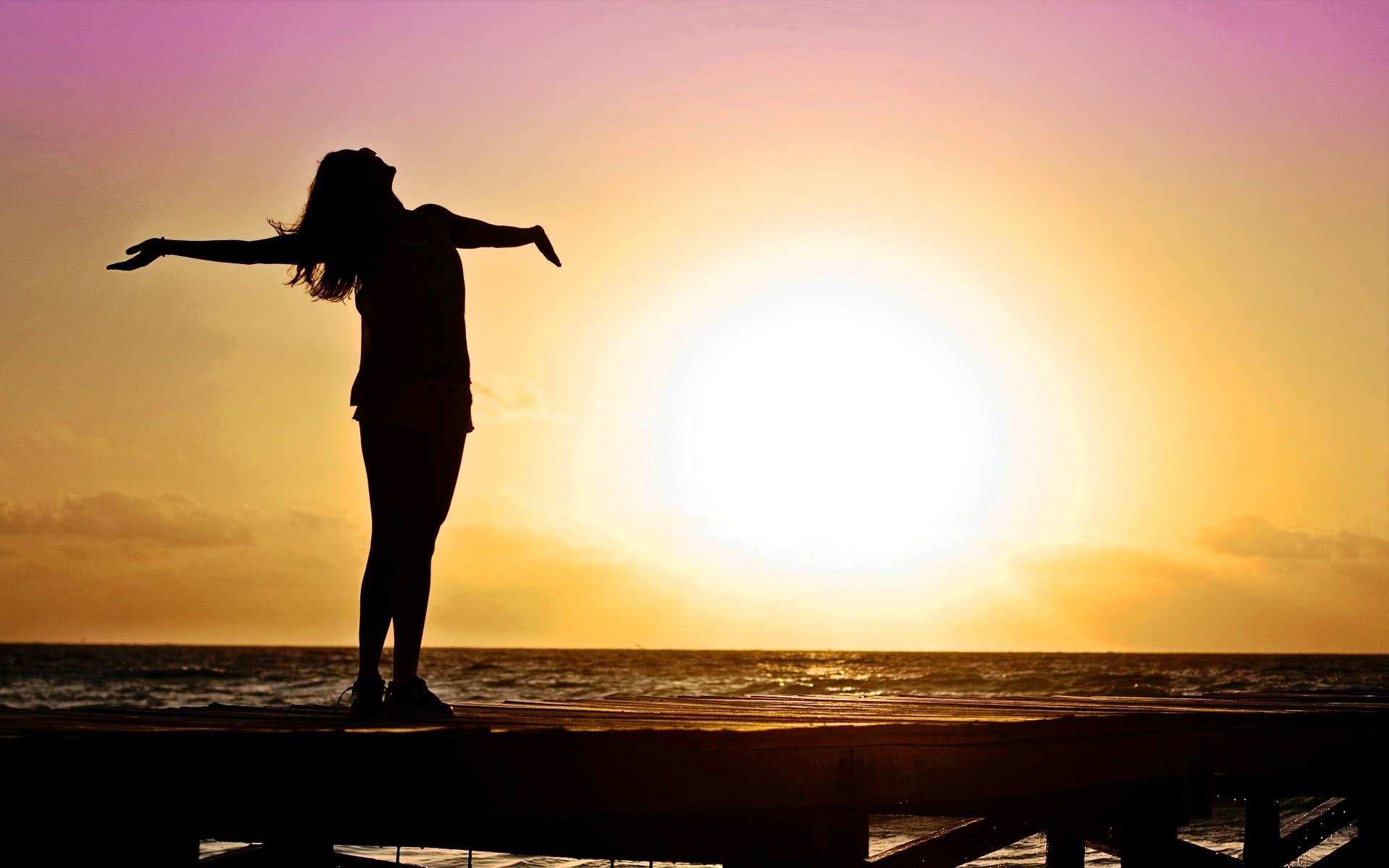 woman pier sunset joy