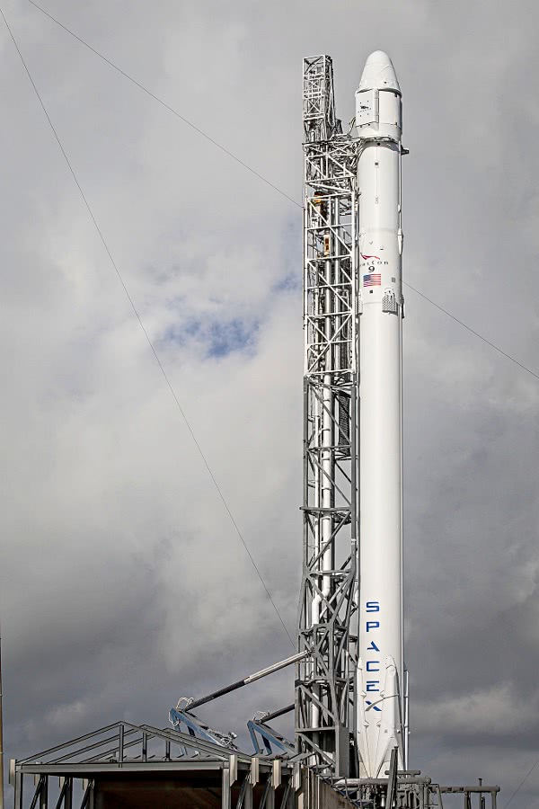 Falcon 9 and Dragon on launchpad